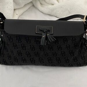 Vintage Dooney and bourke vintage tassel bag- black. A little wear on corners